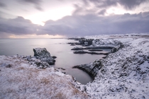 Waves crashing into the basalt sea cliffs of Arnarstapi in Icelands Snfellsnes peninsula 