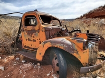 We found an old tow truck abandoned near Red Mountain Open Space in Colorado Its slowly sinking and being grown over