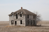 What must have once been a beautiful home now decaying in a farm field in Nebraska 