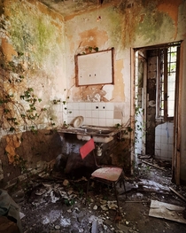 What used to be the kitchen of a bar inside a psychiatric hospital thats been shut down in 