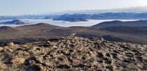 Wind carved rock above the clouds of Baffin Island Nu Canada 