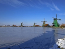 Windmills during winter in Zaandam the Netherlands 