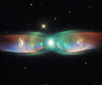 Wings of a Butterfly The Twin Jet Nebula Within these lobes two huge jets of gas are streaming from the star system at speeds in excess of one million kilometers  miles per hour Credits ESAHubble amp NASA 