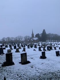 Winter graveyard and church England