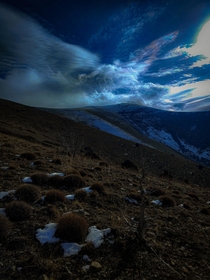 Wintery Mountain scene overlooking mysterious clouds 